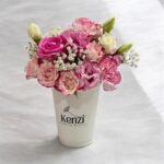 pink flowers in a coffee cup