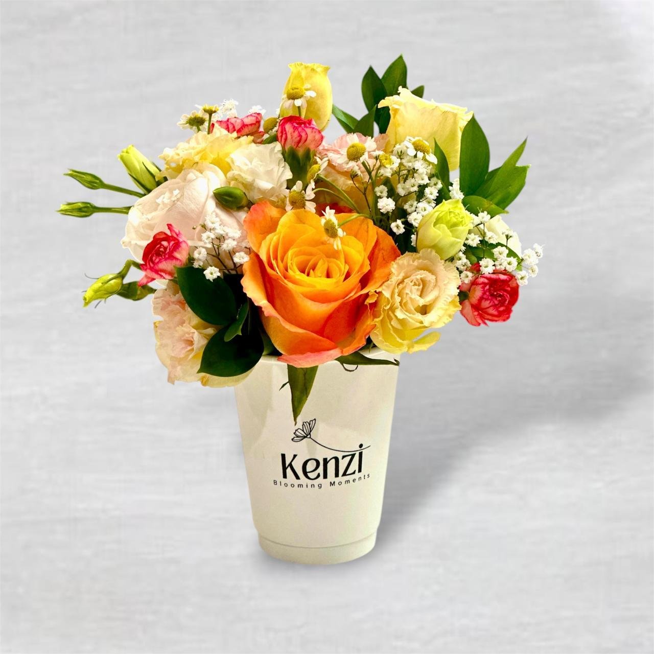 2026/04/1000048155.jpg Yellow and orange flowers in a coffee cup - Image 1